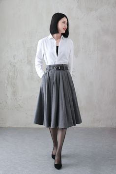 Wool Midi Skirt For Workwear, Winter Office Skirt With Pockets, Winter Workwear Skirt, Formal Wool Skirt For Spring, Formal Spring Wool Skirt, Chic Wool Flared Skirt Bottoms, Spring Formal Wool Skirt, Classic Full Skirt For Workwear, Gray Midi Skirt For Work