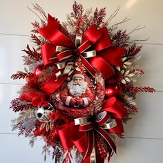 a christmas wreath with santa claus on it