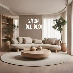 a living room with a large round coffee table in front of a white couch and wooden shelves