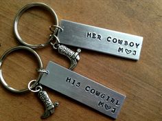 two metal keychains that say her cowboy and his cowgirl