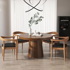 a dining room table with chairs around it and a vase on top of the table