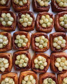 there are many different types of food in the trays on the table, including potatoes