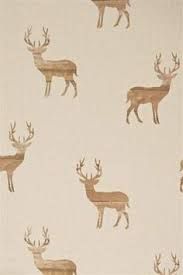 a white and brown wallpaper with deer on it