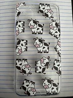 a cell phone case with cows on the front and back cover in black and white