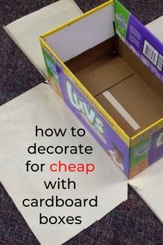 an open cardboard box sitting on top of some white paper with the words how to decorate for cheap with cardboard boxes