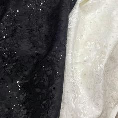 two black and white dresses sitting next to each other