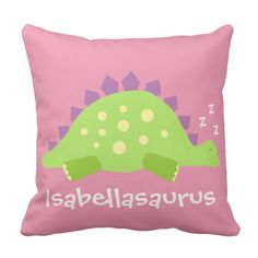 a pink pillow with a green dinosaur on it's back and the words, i am