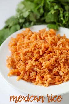 a white plate topped with rice next to lettuce