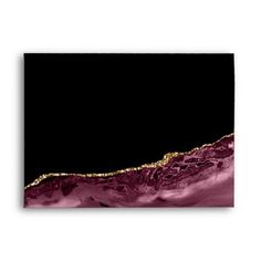 an abstract painting with pink and gold paint on black paper, in the shape of a wave