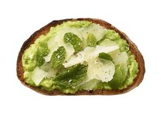 an avocado sandwich with mint and mozzarella sprinkled on top