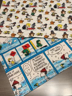 peanuts comic strip wrapping paper on top of a table