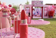 there are many pink decorations on display in the yard for girls to enjoy their time