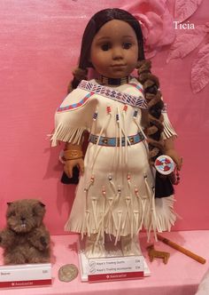 an american girl doll and her teddy bear on display at a museum exhibit in mexico