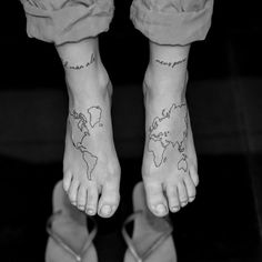 a person's feet with a map tattoo on their left foot and the words, love is in the air