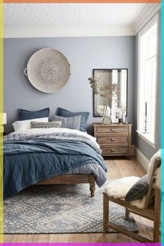 a bed room with a neatly made bed next to a window and a rug on the floor