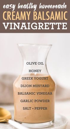 homemade creamy balsamic vinaigrette in a glass bottle with spoons on the side