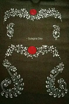 an embroidered black shirt with white and red designs on it, along with the words suganna day