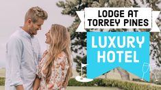 a man and woman standing next to each other in front of a sign that says lodge at torrey pines luxury hotel