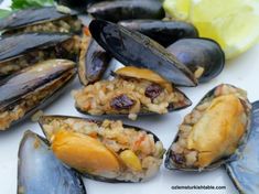 mussels with rice and lemon on a plate