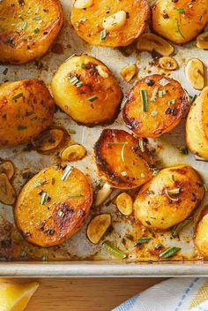 roasted potatoes and mushrooms on a baking sheet