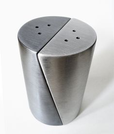 a metal object with holes in it on a white background