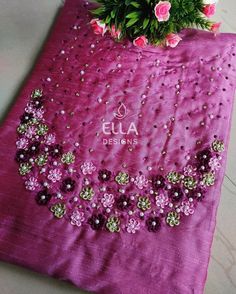 a purple table cloth with flowers on it