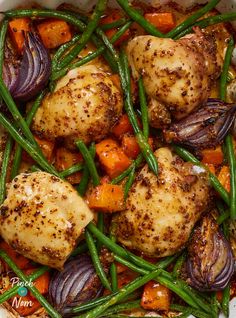 chicken, green beans and carrots in a white bowl