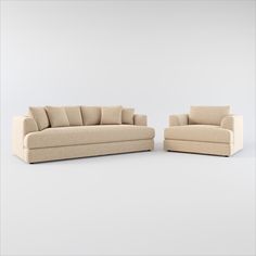 two beige couches sitting next to each other on a white surface with no one in it