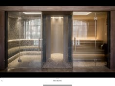 the inside of a sauna with glass doors