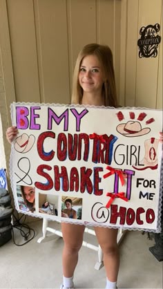 a girl holding up a sign that says be my country girl and shake it for me