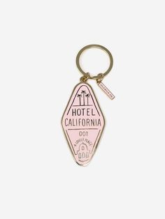 the hotel california keychain is pink and has a small bottle opener on it