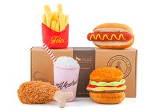 an assortment of fast food items including fries, hot dog and burger