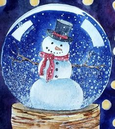 a snowman in a top hat and scarf is inside a glass ball with lights around it