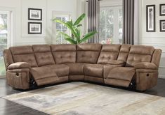 a large sectional couch with recliners in front of a window and rug on the floor