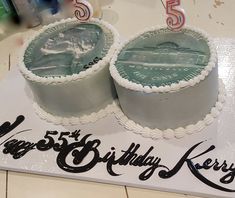 two birthday cakes sitting on top of a table