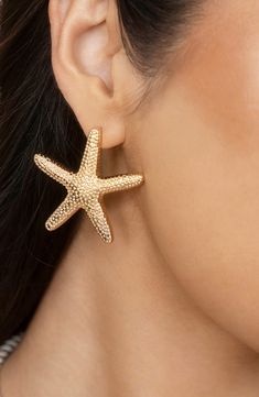 Glamour and nature convene in these statement-sized starfish stud earrings plated in warm 18-karat gold. 1 1/2" diameter Post back 18k-gold plate Imported Stella Marina, Prom Earrings, Starfish Earrings, Boho Chic Jewelry, Gold Collar, Studs Earrings, Trendy Earrings, Shell Earrings, Simple Earrings