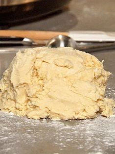 a scoop of dough sitting on top of a table