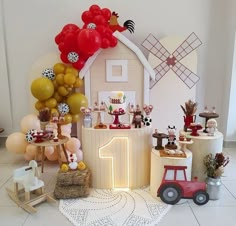 an image of a birthday party with balloons and decorations on the table in front of it