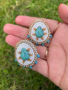 Turquoise centers edged with glass beads. Backed with plastic gauges and leather. Beaded Turquoise Earrings, Gauge Plugs, Native Fashion, Plug Earrings, Native American Beadwork, Earring Ideas