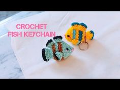 crochet fish keychain on top of a white towel with the words crochet fish keychain next to it