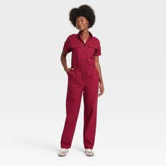 Elevate your wardrobe with this Boilersuit from Universal Thread™. Made from recycled cotton with added spandex, this boilersuit features relaxed-fit legs and an ankle length. The boilersuit comes in a short-sleeve design with a collared neckline and boasts multiple pockets for practicality. The elastic waistband and front buttons add extra flair for an on-trend look. Universal Thread™: Found exclusively at Target. Utility Jumpsuit Outfit, Cargo Jumpsuit, Utility Jumpsuit, Women Jumpsuit, Boiler Suit, Jumpsuit Outfit, Playsuit Romper, Women Maxi, Hem Style