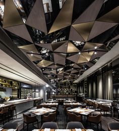 the interior of a restaurant with tables and chairs