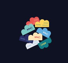 several different colored business cards stacked on top of each other in the shape of hearts