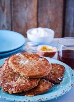 some pancakes are stacked on a blue plate