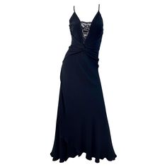 Sexy, yet classic early 2000s VALENTINO black silk and lace cut-out evening gown ! Features a tailored bodice with black lace sequin cut-out detail with rhinestone encrusted buckle at bust. Train at back hem can be worn down, or attaches to the skirt with a hidden hook-and-eye. Hidden metal zipper up the back with an additional hook-and-eye closure. Criss-cross straps in the back. Couture quality with so much attention to details. In great unworn condition Made in Italy Marked Size US 6 Measurem Early 2000s Runway Dresses, Early 2000s Runway, Sequin Evening Gowns, Silk And Lace, Lace Formal Dress, Evening Gown Dresses, Black Dress Formal, Valentino Black, Runway Dresses