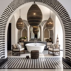 an ornate bathroom with black and white tile flooring, large round bathtub in the center