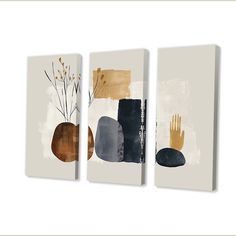 three canvases with different shapes and colors on them, one has a plant in the middle