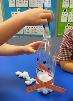 someone is making a snowman in a bottle for the kids to play with it