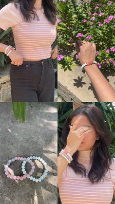 a woman standing in front of flowers holding her hand up to her face and wearing bracelets