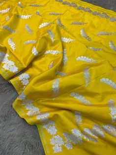 This is a very beautiful high quality mashru silk saree . All over zari motifs design with border . Saree length - 5.5 mtr. Blouse - 1 mtr. Dry clean only . Please note - color may be vary a little due to sunlight and photography . Please message us after purchasing in case you want fall and Pico done it not . No extra charges for fall and Pico but inform us . Blouse stitching is also available . Yellow Blouse Piece With Motifs For Eid, Raw Silk Saree For Diwali, Yellow Raw Silk Traditional Wear With Motifs, Yellow Blouse Piece With Zari Weaving For Eid, Dola Silk Saree For Puja And Eid, Diwali Raw Silk Saree, Yellow Silk Pre-draped Saree With Self Design, Yellow Self Design Paithani Silk Blouse Piece, Yellow Raw Silk Blouse Piece For Eid